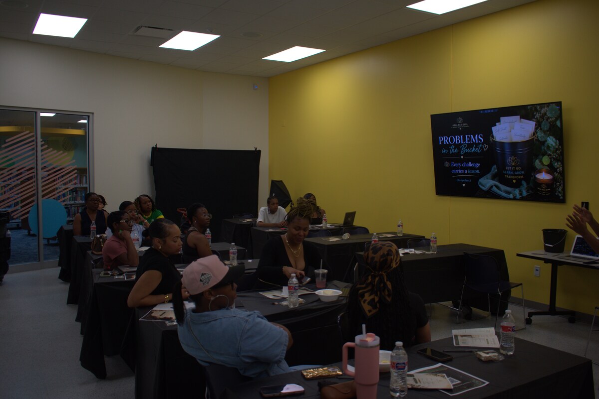 Wide view of the gathering room in Cincinnati with attendees seated at tables facing the presentation screen